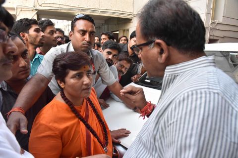 Pragya Thakur (in orange) is seen after a meeting at a state BJP office on April 17 in Bhopal, India.