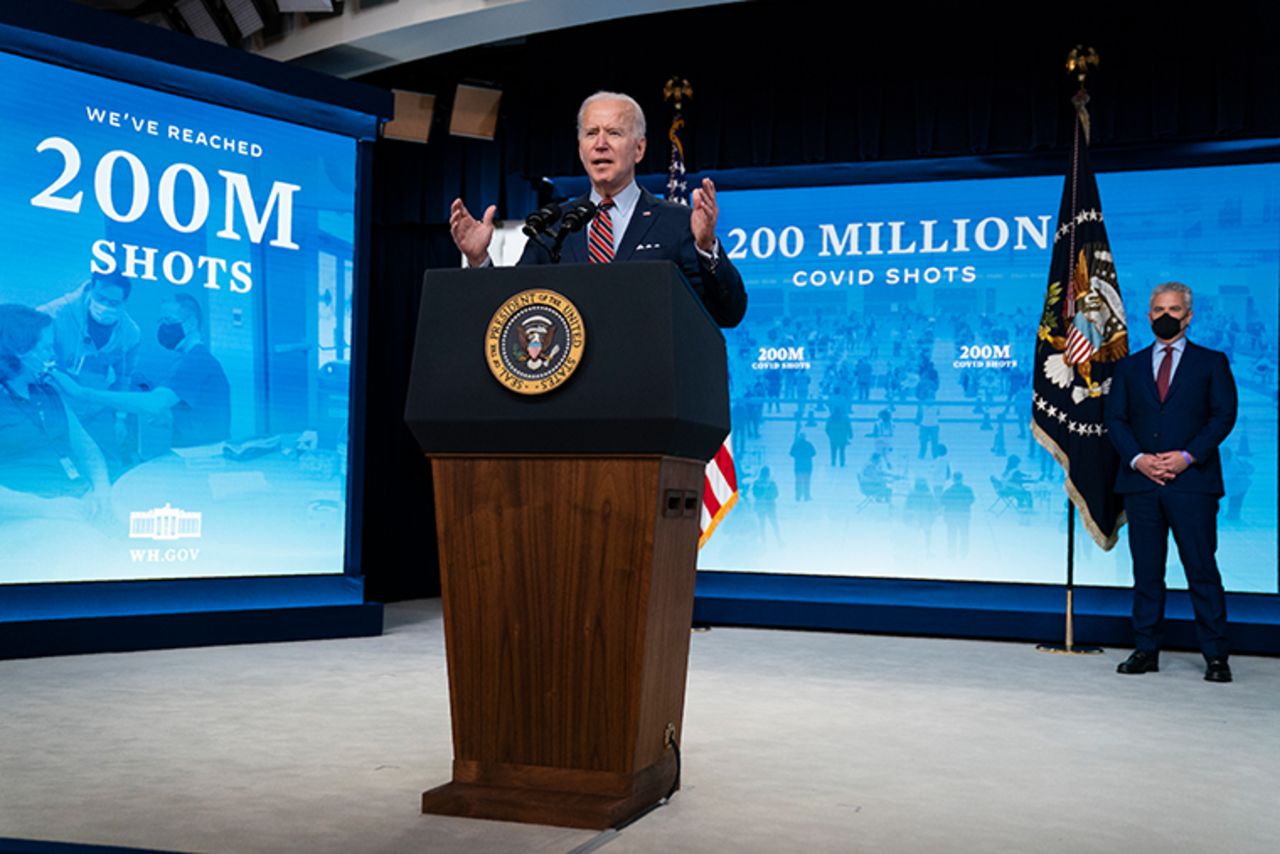 White House COVID-19 Response Coordinator Jeff Zients, right, listens as President Joe Biden speaks about COVID-19 vaccinations at the White House, Wednesday, April 21, 2021, in Washington.