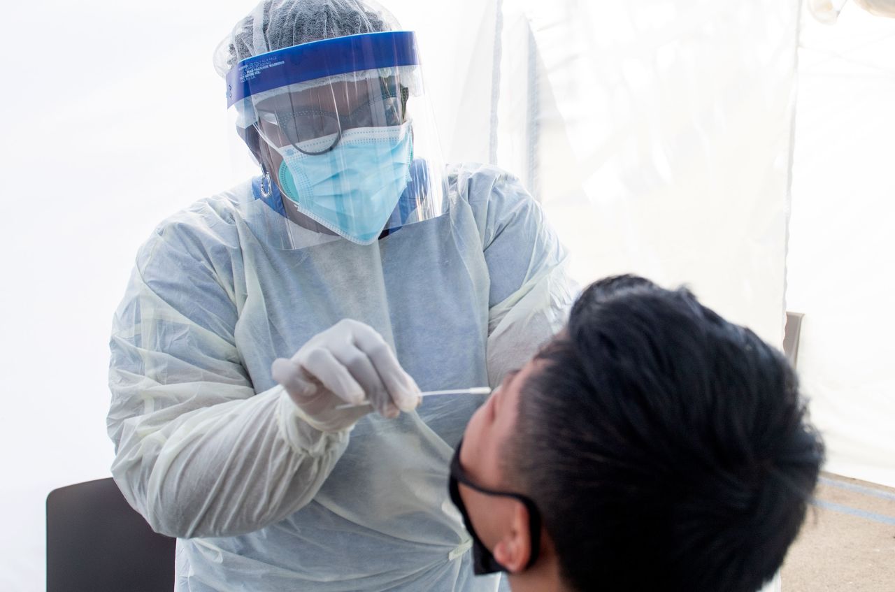 A health worker takes a nasal swab sample at a Covid-19 testing site on July 24 in Los Angeles, California.