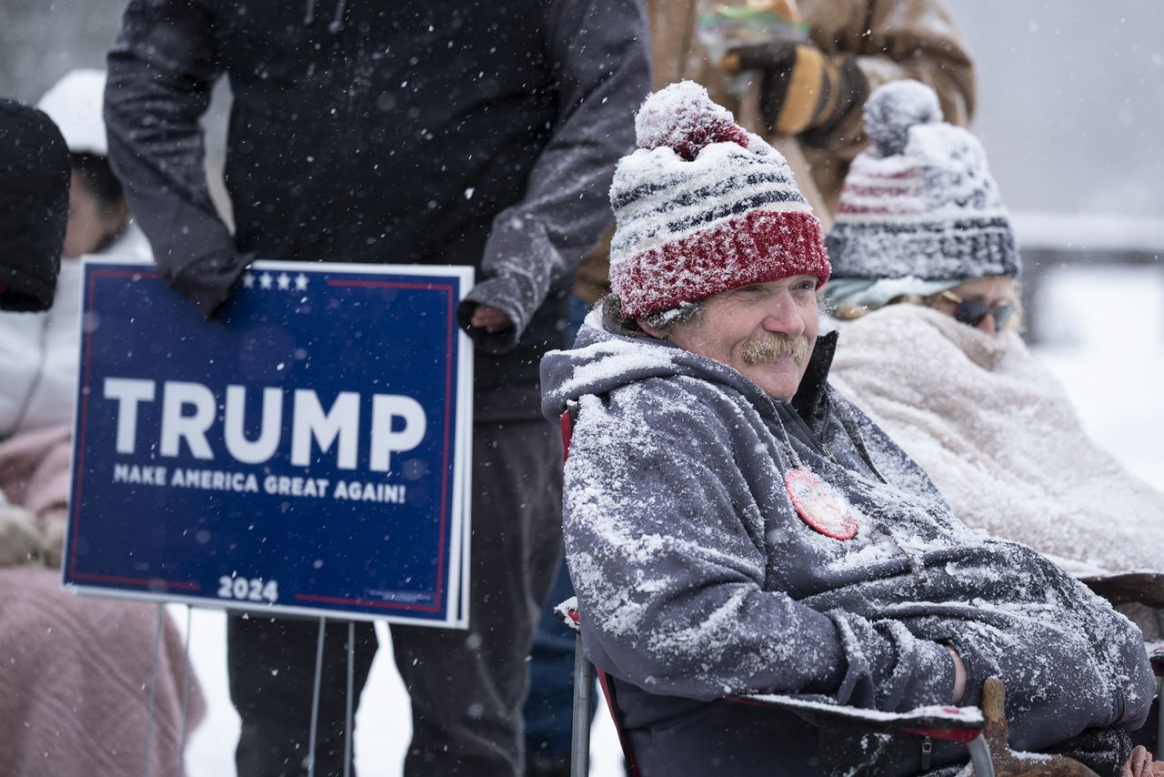 Donald Trump supporters wait in line to enter a campaign event in Atkinson, N.H., today.