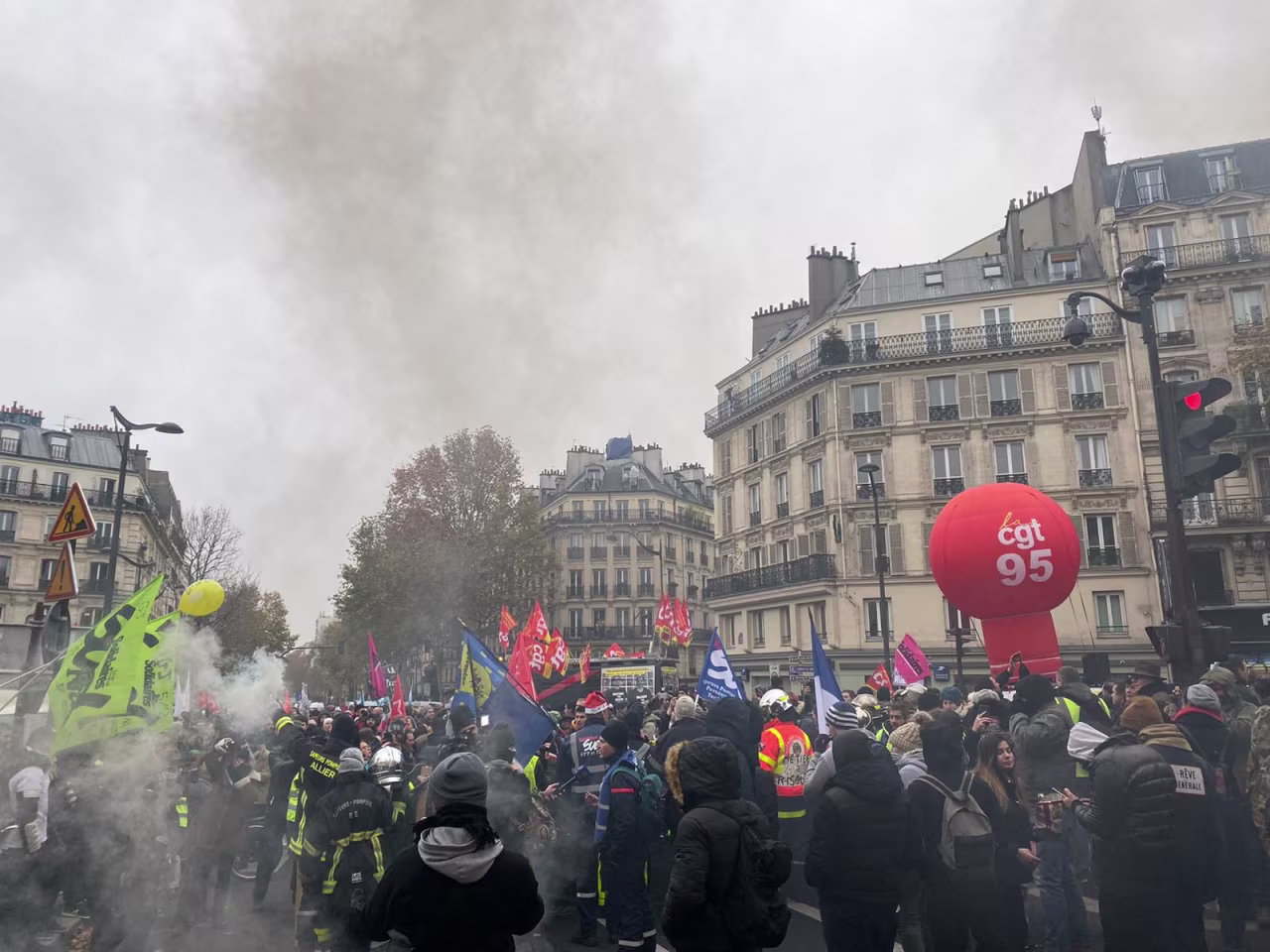 Demonstrators use smoke in Paris on Thursday. 