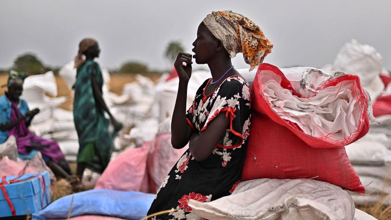 A villager who had volunteered to fetch bags containing food rations from the site of an air drop takes a break at a village in Ayod county in South Sudan on February 6.