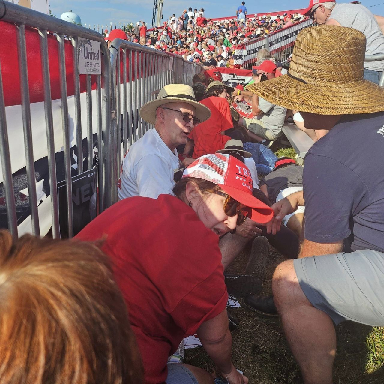 Attendees duck for safety at former President Donald Trump’s rally in Butler, Pennsylvania, on July 13.