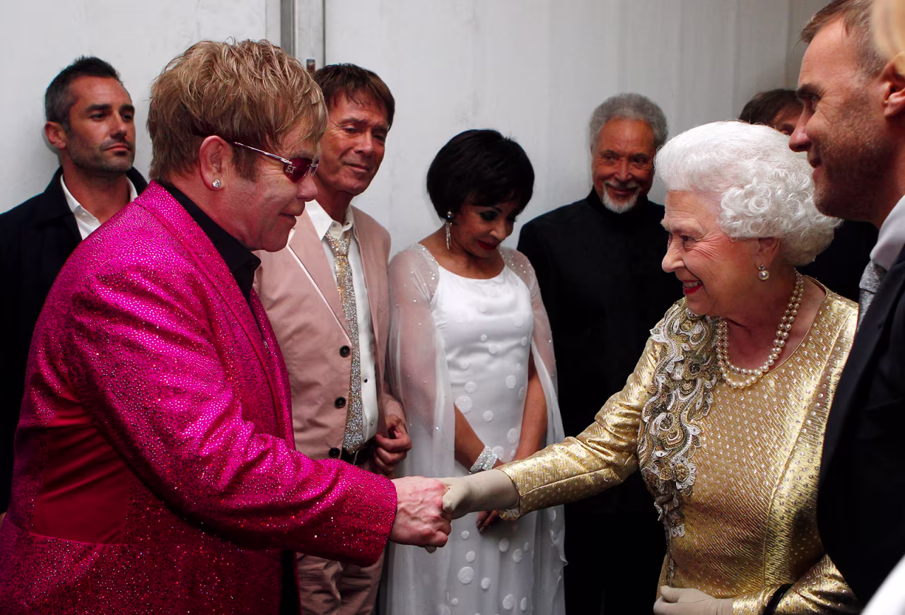 Queen Elizabeth meets with singer Elton John in London on June 4, 2012.