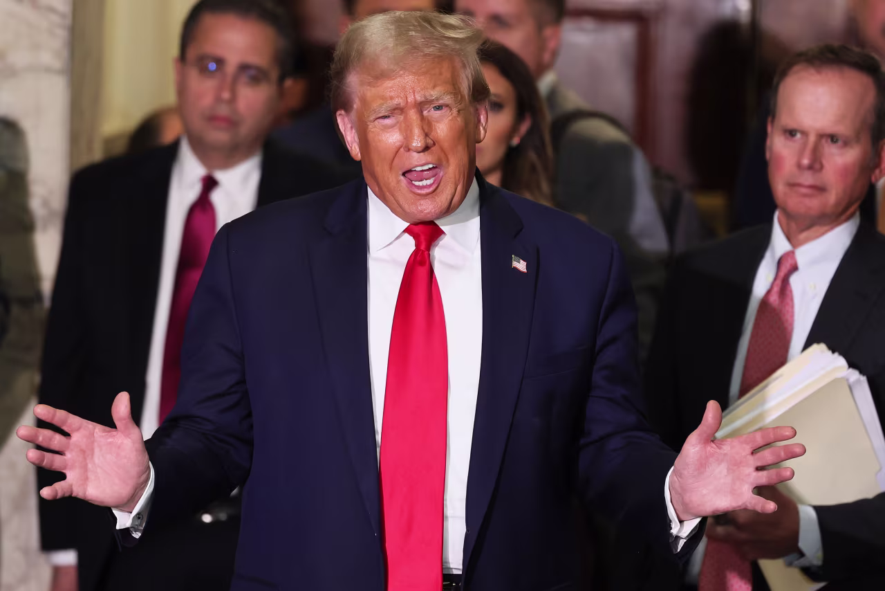 Former President Donald Trump speaks to the press during a break in his civil fraud trial at New York State Supreme Court on October 17.