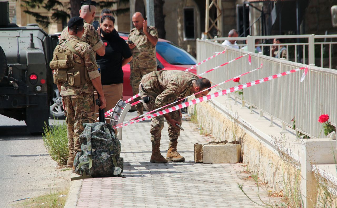 Lebanese army members prepare to carry out a controlled explosion of a battery of a communications device in the town of Qlayaa, Lebanon, on September 19.