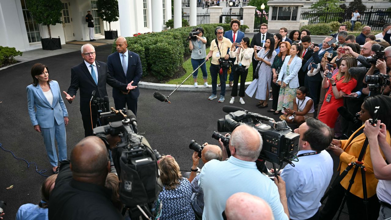 Minnesota Gov. Tim Walz, flanked by New York Gov. Kathy Hochul and Maryland Gov. Wes Moore, speaks to repoters after meeting with President Joe Biden at the White House in Washington, DC, on July 3. 
