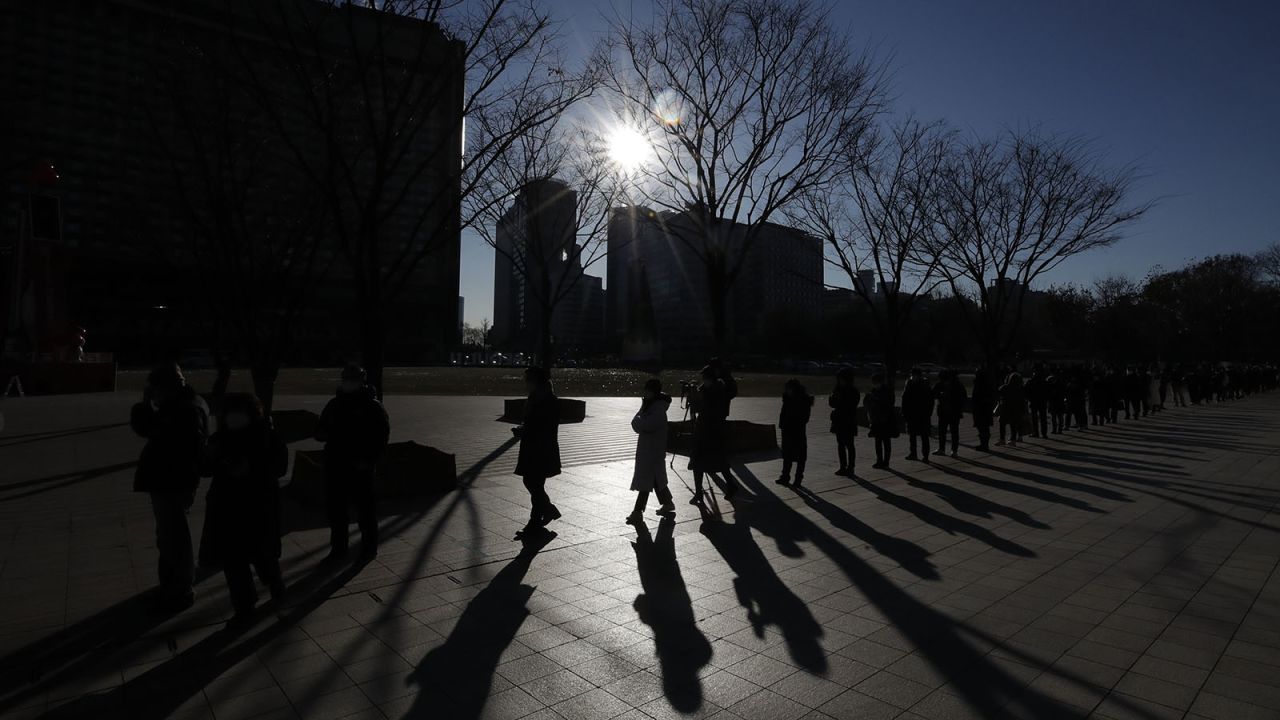 People queue in line to wait for coronavirus testing in Seoul on Thursday, December 17.