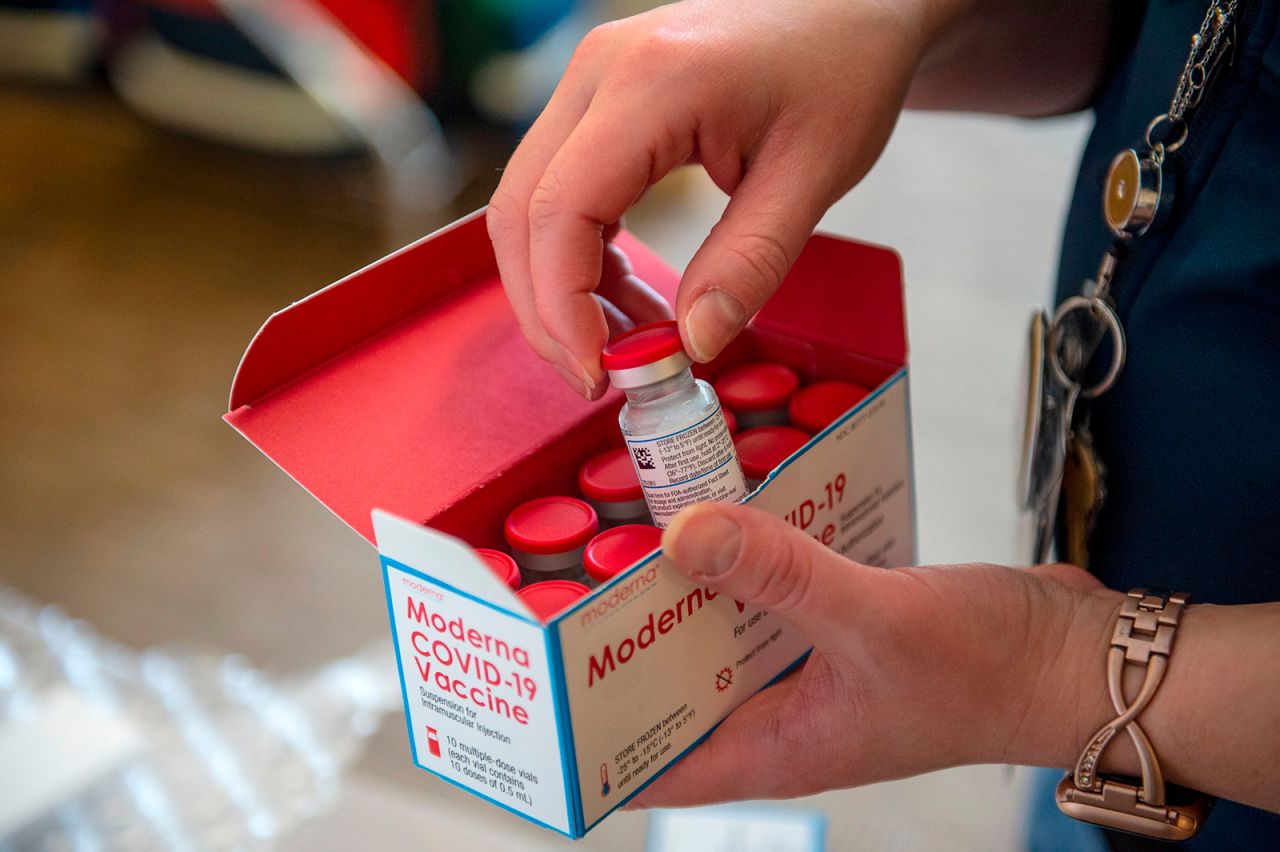 Courtney Senechal unpacks Moderna Covid-19 vaccines for use at the East Boston Neighborhood Health Center in Boston, Massachusetts on December 24, 2020.