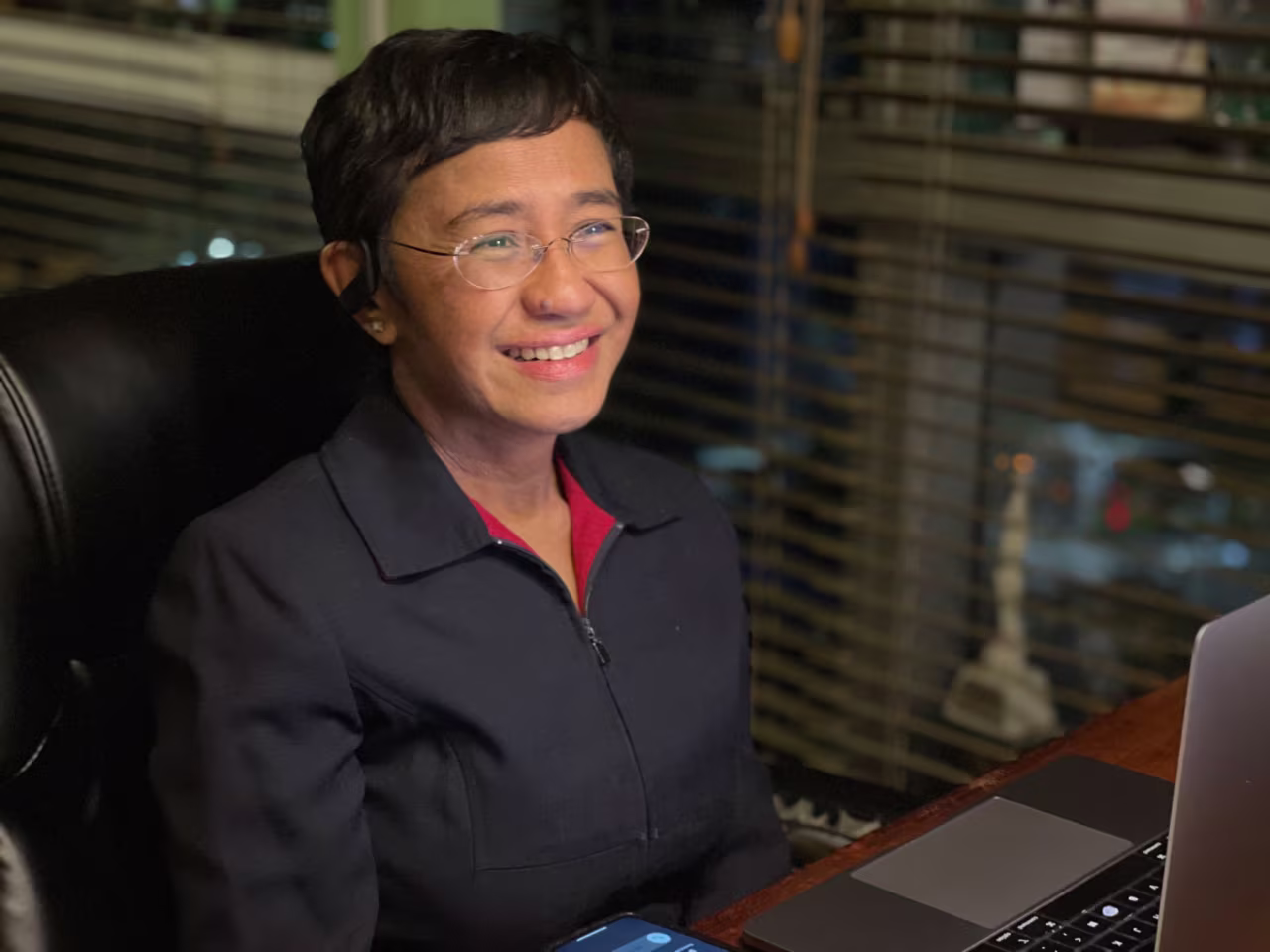 In this photo provided by Rappler, CEO and Executive Editor Maria Ressa reacts after hearing of her winning the Nobel Peace Prize inside her home in Metro Manila, Philippines on October 8, 2021.