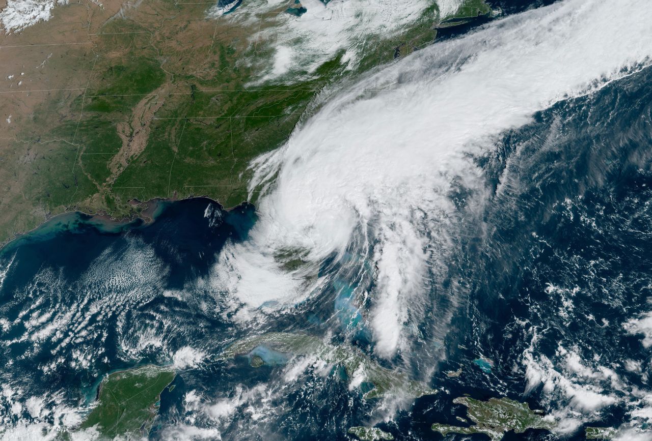A satellite image from the National Oceanic and Atmospheric Administration shows Tropical Storm Ian moving over the east coast of Florida into the Atlantic on Thursday at 11:06 a.m. ET.