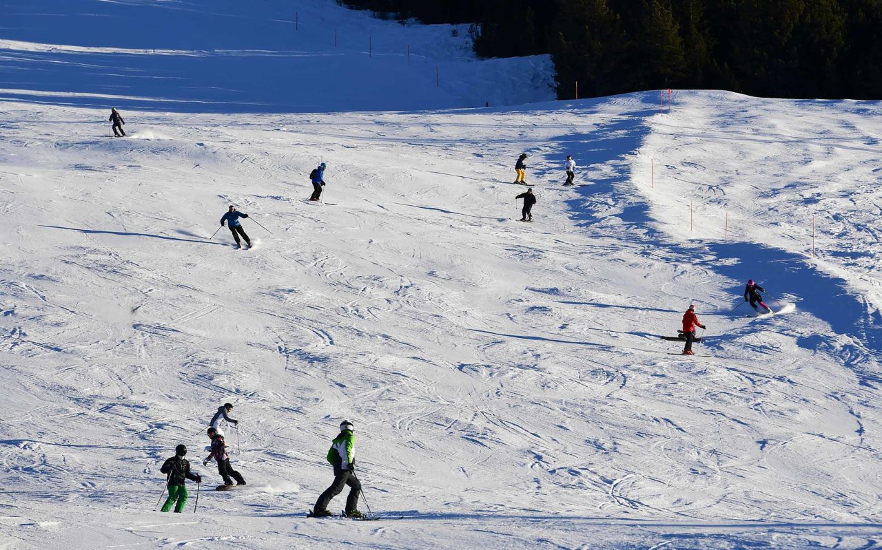 Tourists ski at the Stelvio National Park resort in Bormio, Italy, on December 26, 2018.