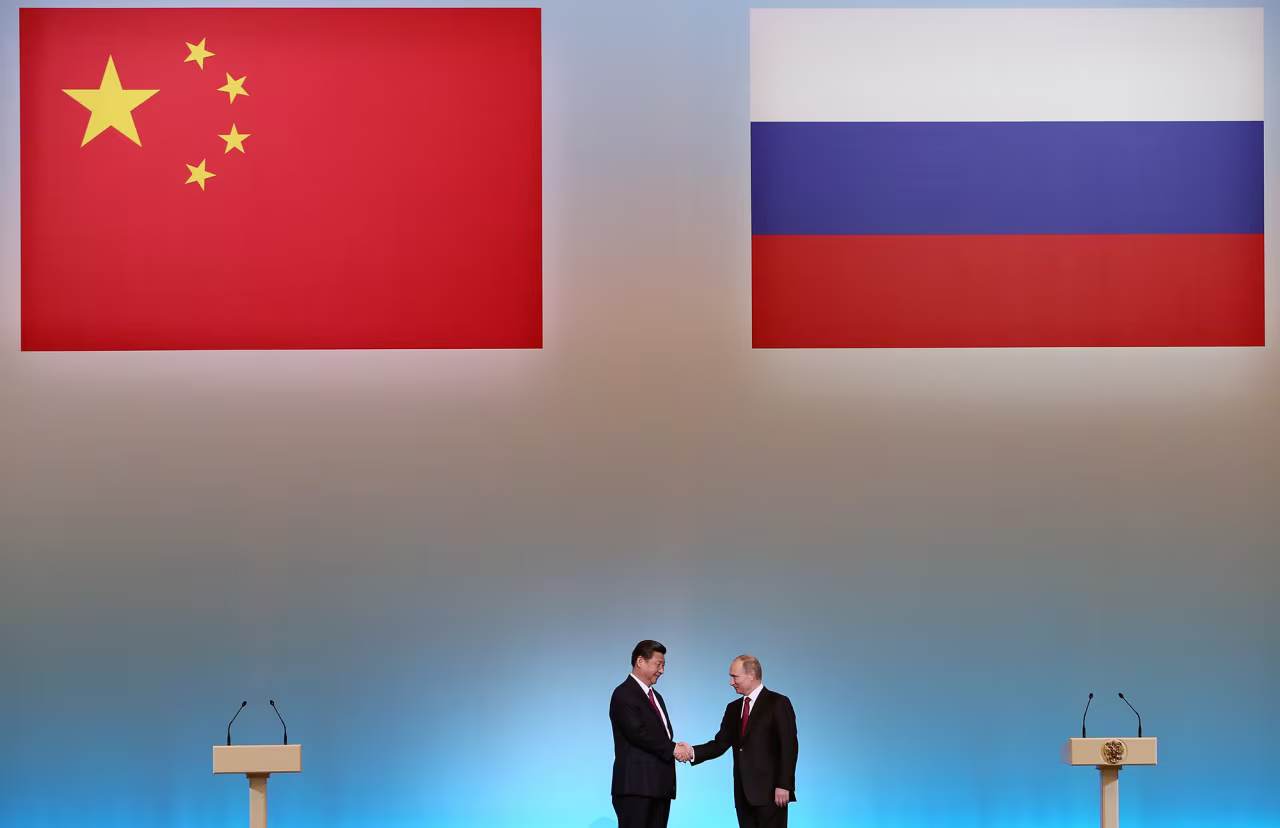 China's President Xi Jinping, left, is welcomed by his Russian counterpart Vladimir Putin during the opening ceremony of "The Year of Chinese Tourism in Russia" in Moscow, on March 22, 2013.