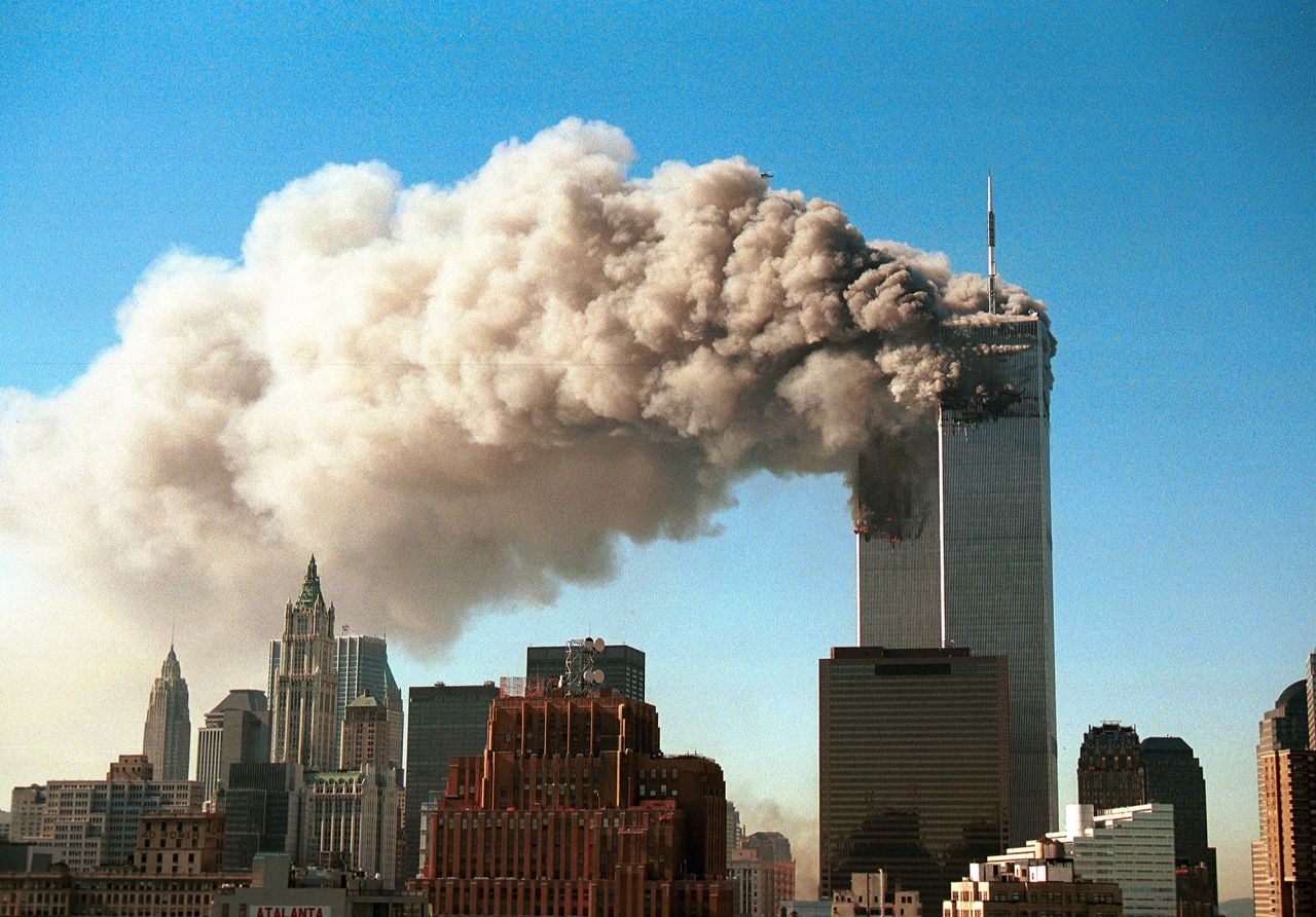 Smoke pours from the twin towers of the World Trade Center after they were hit by two hijacked airliners on September 11, 2001 in New York City. 