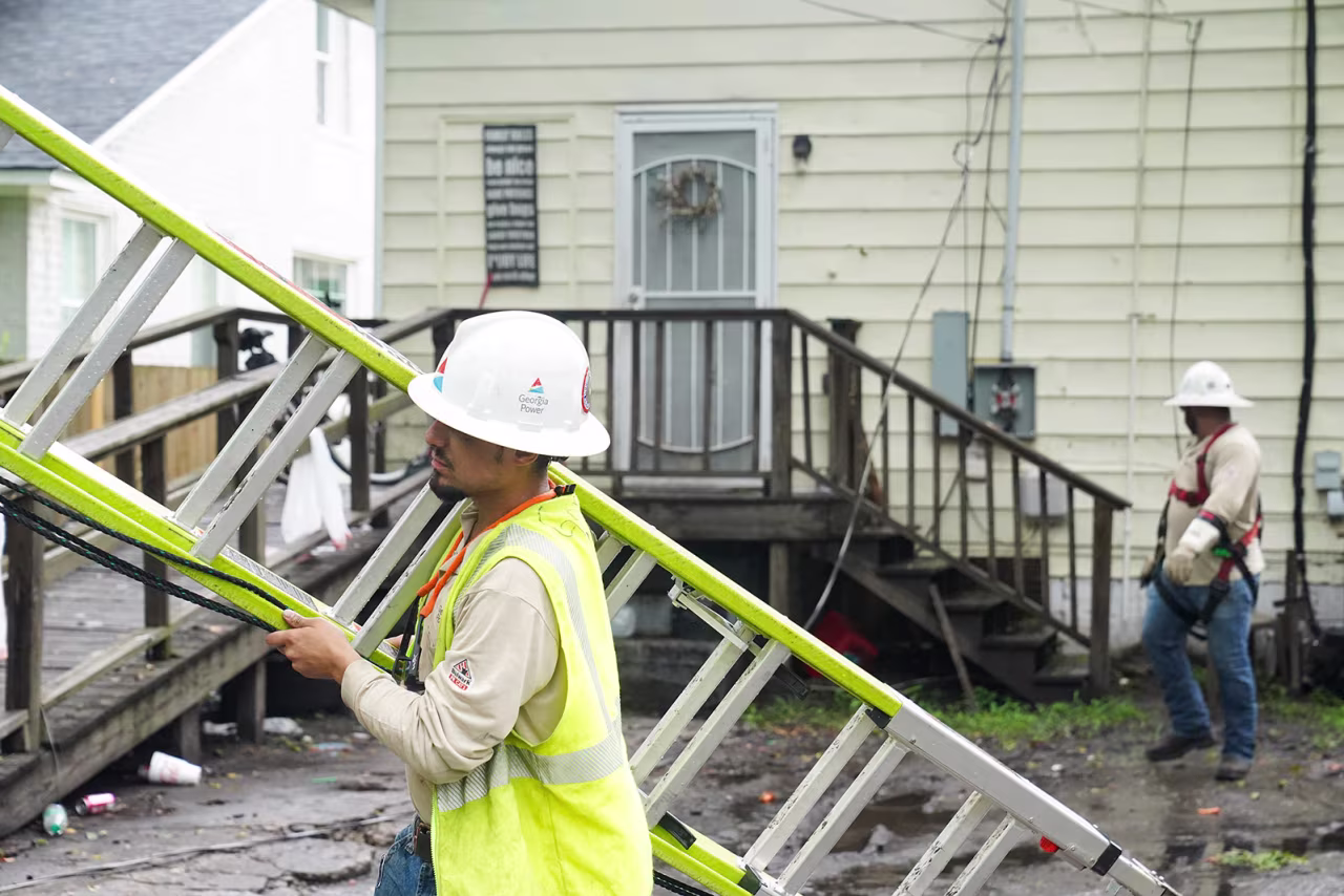 Power line crews come out to help people in Savannah, Georgia, on August 6.