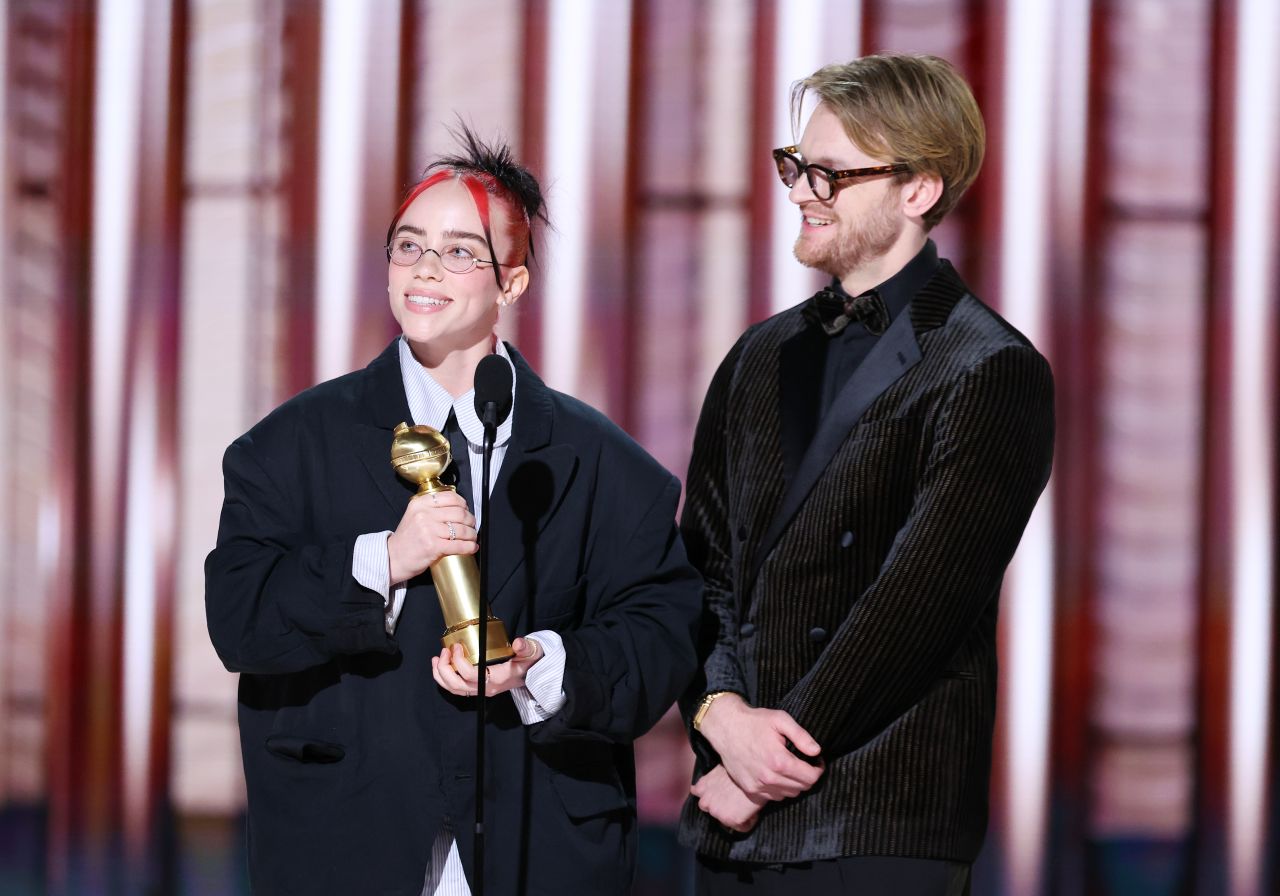 Billie Eilish and Finneas O'Connell accept their Golden Globe award. 