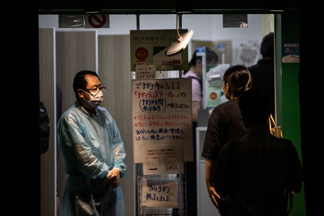 A man wearing personal protective equipment stands in a Covid-19 testing center in Tokyo, on July 14.