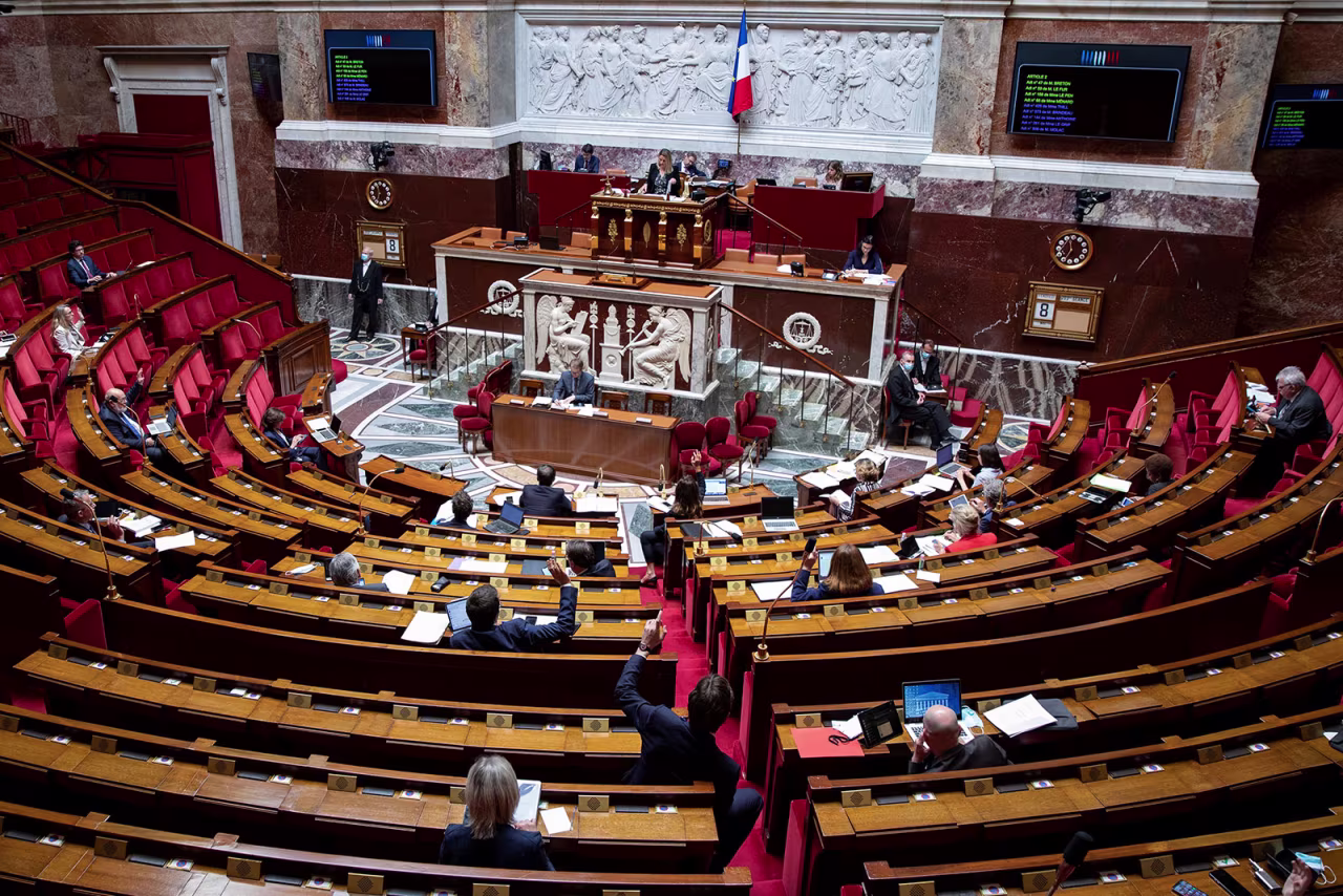 French MPs vote on an amendment during a debate on the extension of the nationwide state of emergency at the National Assembly in Paris on May 8.
