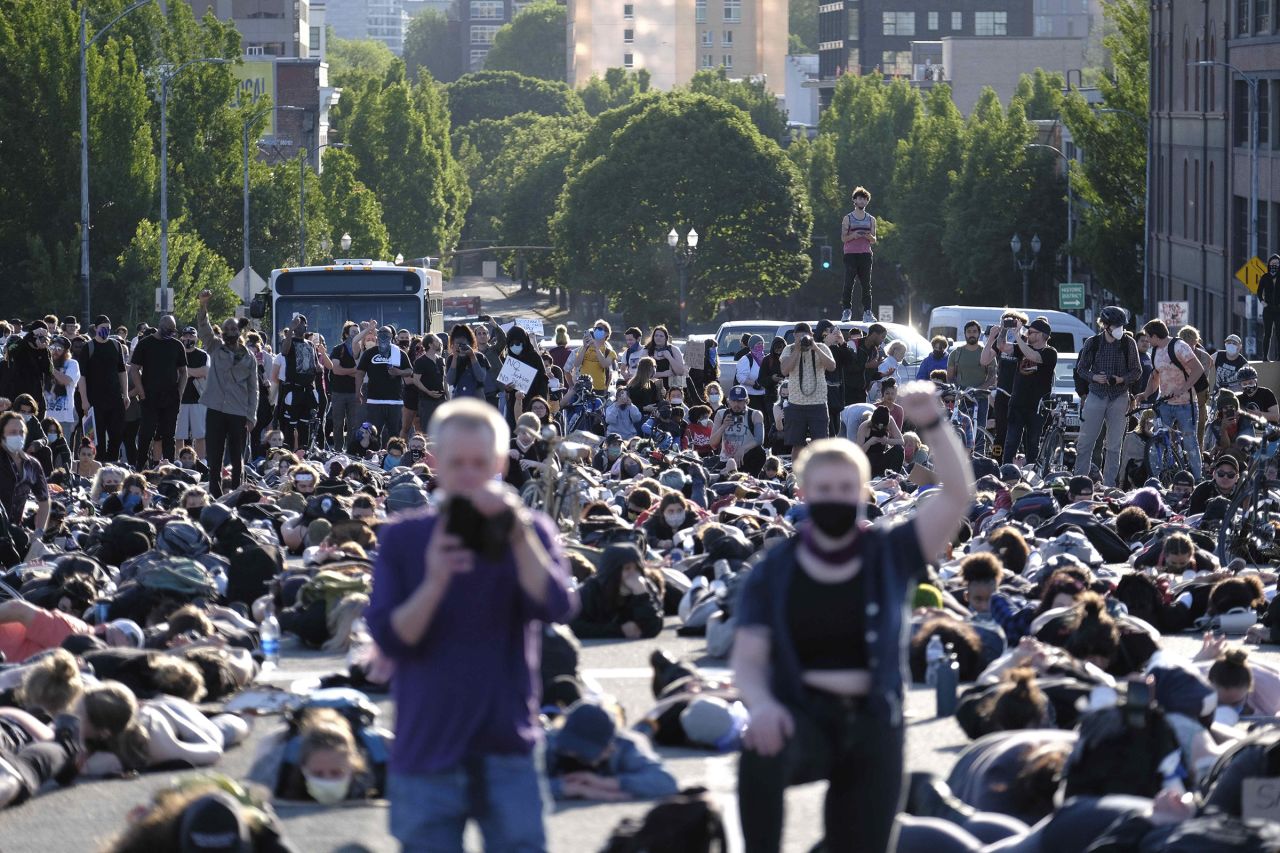 Protesters on the Burnside bridge observe a moment of silence on another day of protests over the death of George Floyd in Portland, Oregon, on June 1.