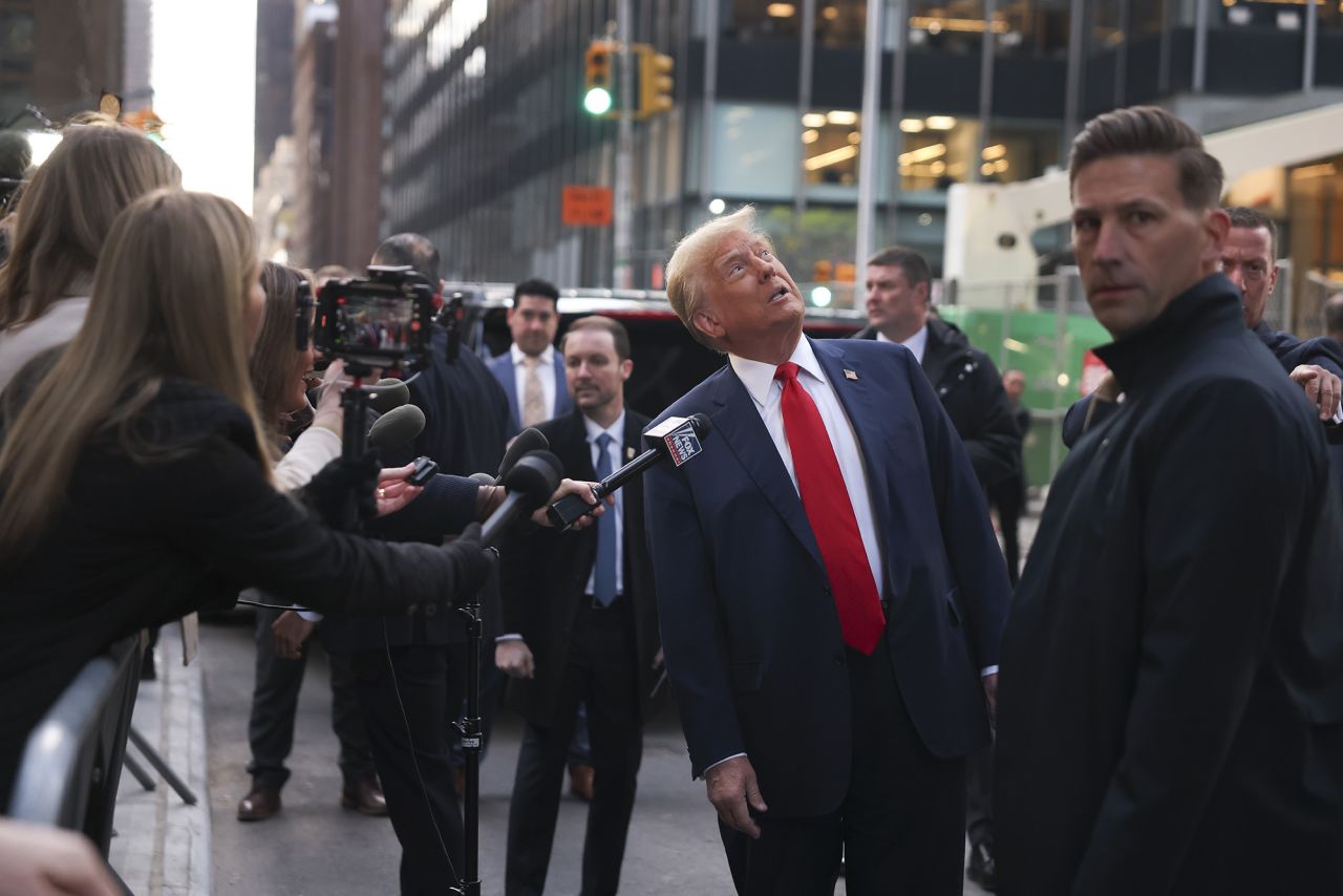 Former President Donald Trump speaks to members of the media while visiting with construction workers in midtown Manhattan, on April 25.