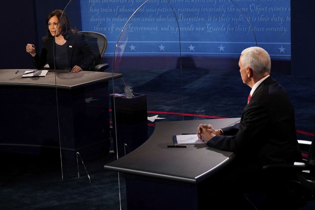 Democratic vice presidential candidate Sen. Kamala Harris, D-Calif., answers a question as Vice President Mike Pence listens during the vice presidential debate on Wed