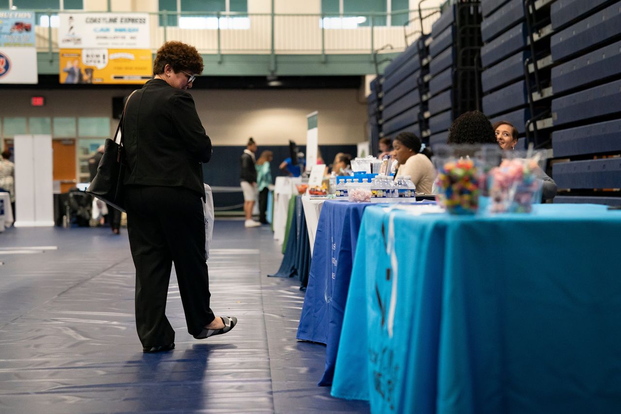 A jobseeker looks at displays at a job fair at Brunswick Community College in Bolivia, North Carolina, on April 11.