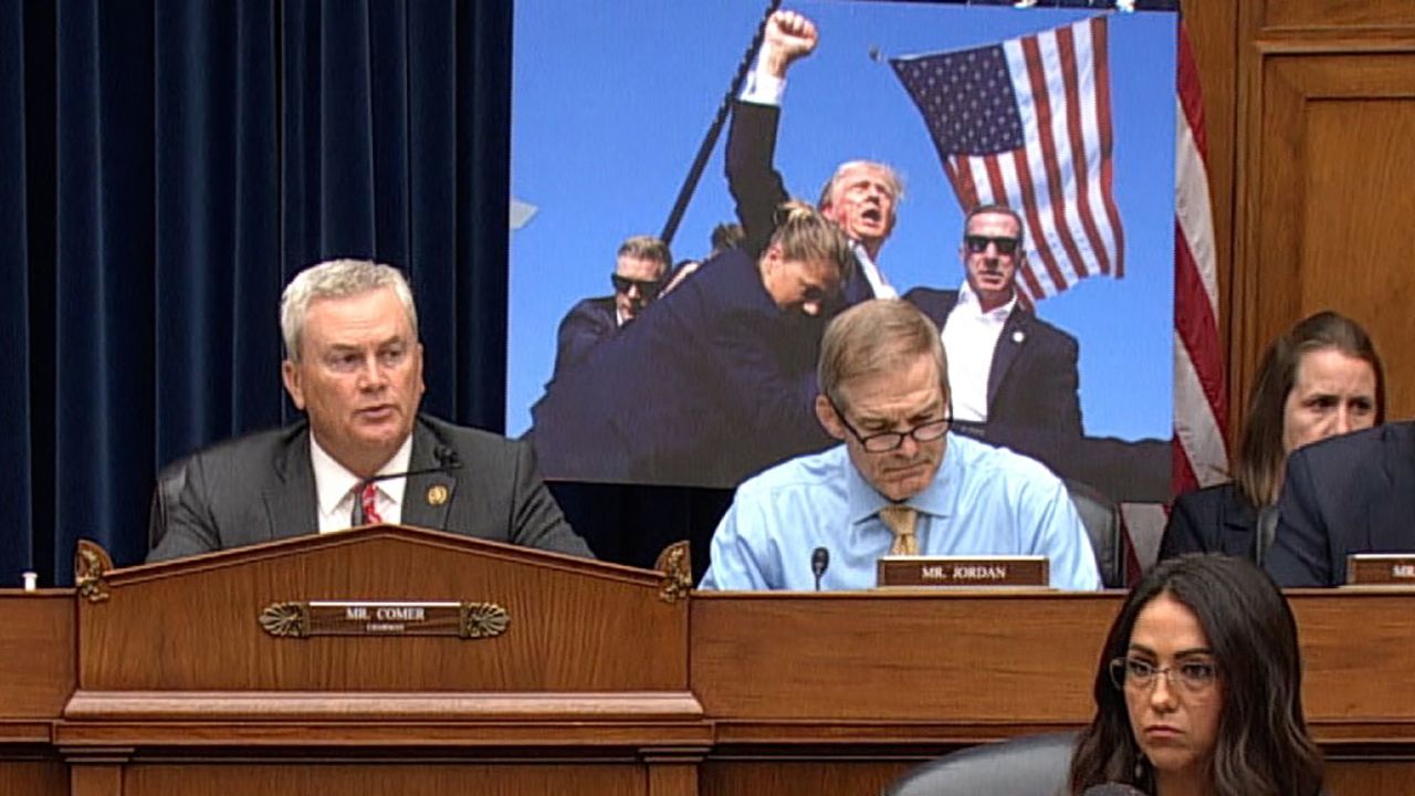 This still from video shows a poster-sized version of the photo taken by AP photographer Evan Vucci following the assassination attempt of former President Donald Trump.