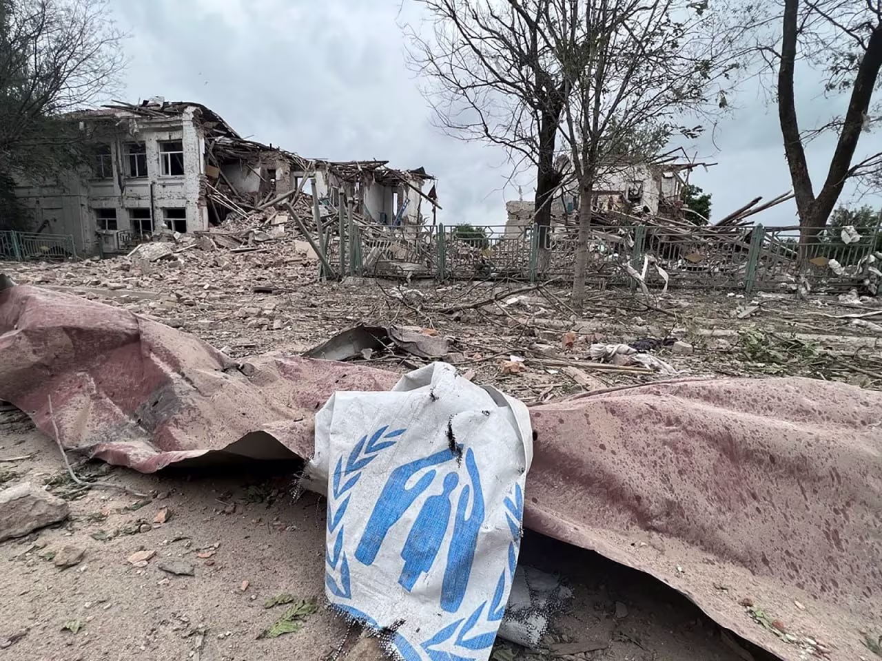 In this handout image from the Zaporizhzhia Regional Military Administration, debris from destroyed buildings is strewn along the ground after a Russian airstrike in Orikhiv on July 10.