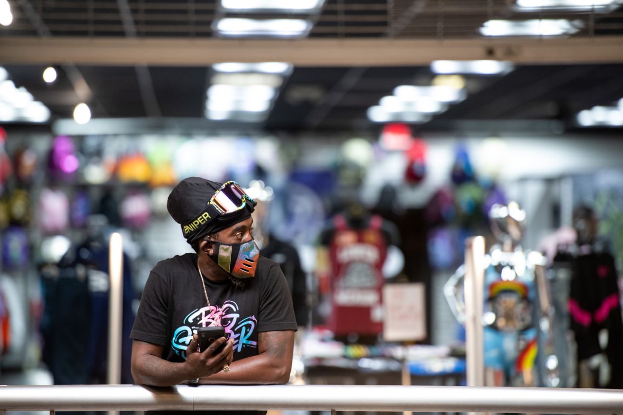 Small business owner Birl Hicks stands in front of his store, Area 57, at Columbia Place Mall on April 24, in Columbia, South Carolina. 