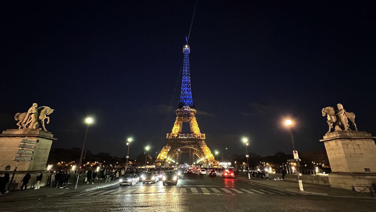 The Eiffel Tower is illuminated in the colors of the Ukrainian flag in Paris, on February 26. 