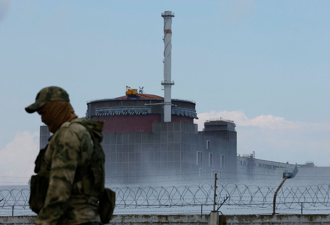 A serviceman with a Russian flag on his uniform stands guard near the?Zaporizhzhia?Nuclear Power?Plant?outside the Russian-controlled city of Enerhodar in the?Zaporizhzhia?region, Ukraine on August 4.