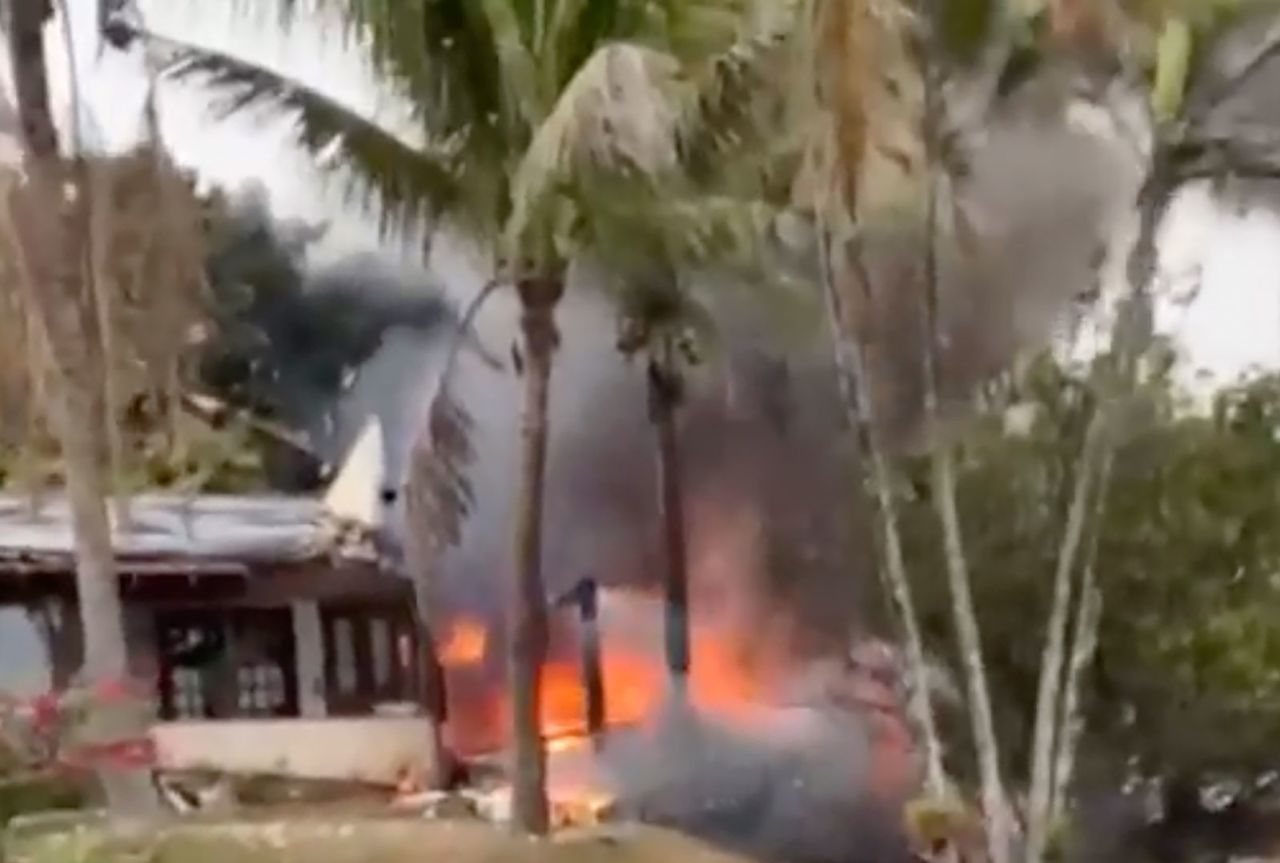 Fire is seen coming from a plane that crashed by a home in Vinhedo, Sao Paulo, Brazil, on Friday.