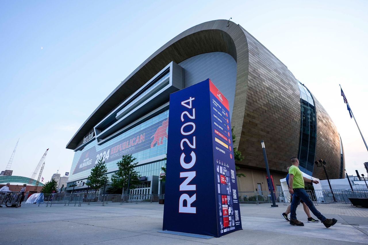 People walk outside the Fiserv Forum ahead of the 2024 Republican National Convention in Milwaukee on Saturday. 