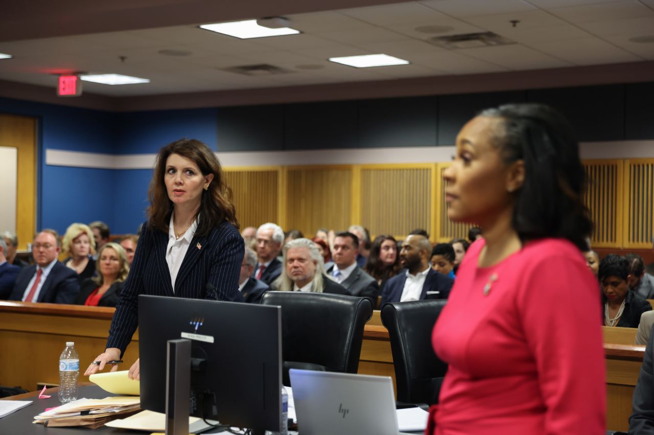 Fulton County Special prosecutor Anna Cross, who is representing the Fulton County District Attorney's office, looks at District Attorney Fani Willis as she enters the courtroom to testify yesterday in Atlanta. 