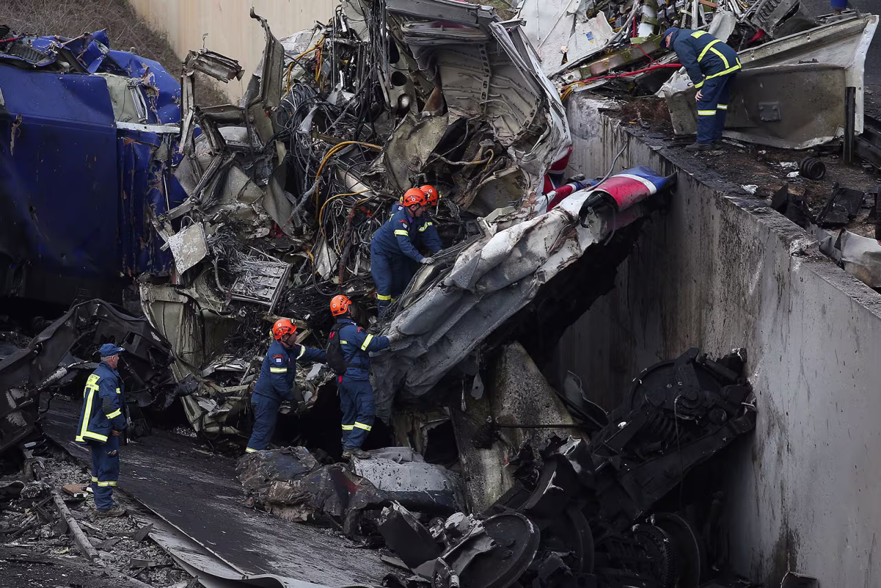 Rescuers operate next to debris of a train after a crash near the city of Larissa, Greece, on March 1.