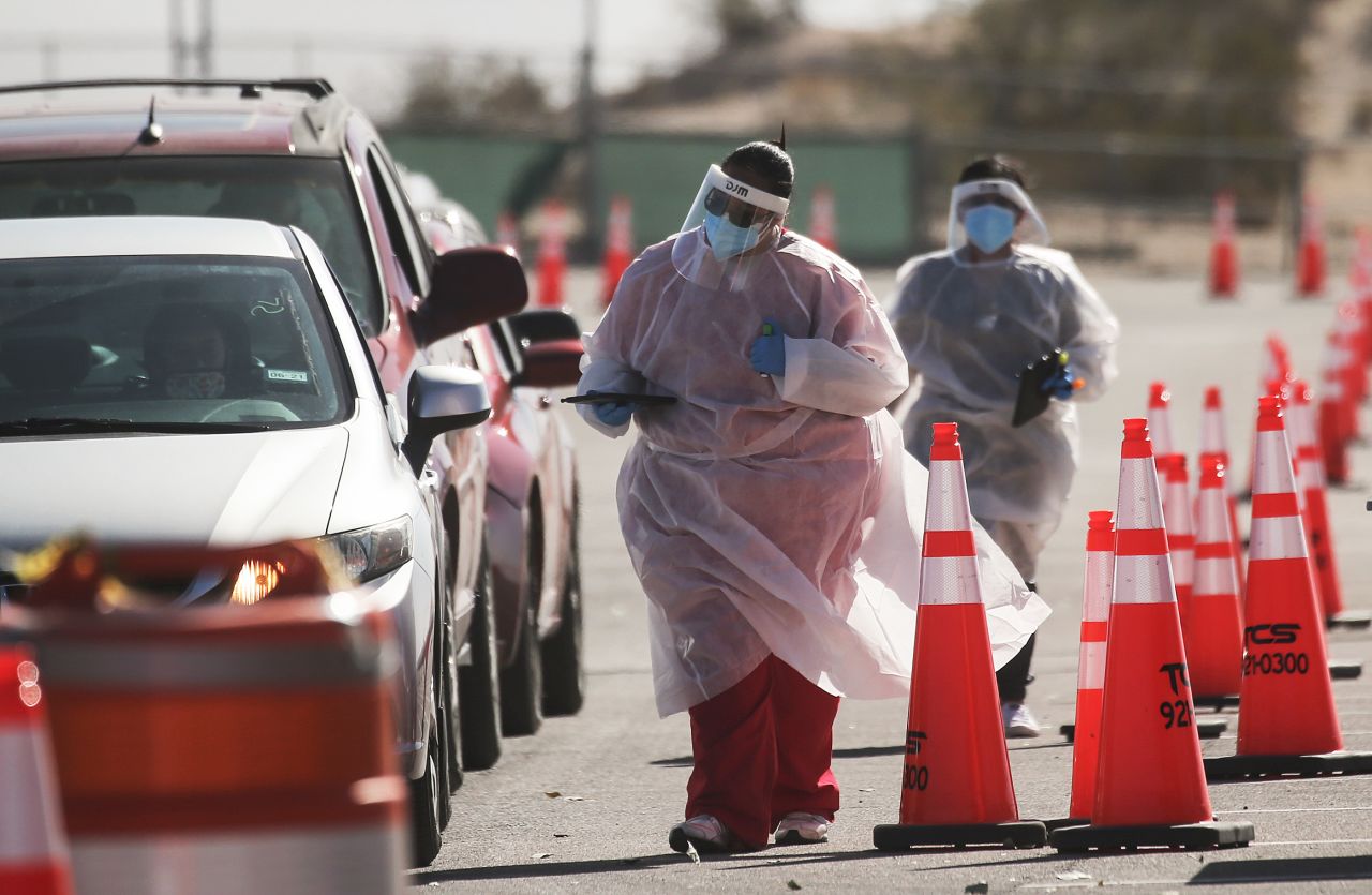 Healthcare workers greet incoming vehicles at a drive-in Covid-19 testing site in El Paso, Texas, on November 14.