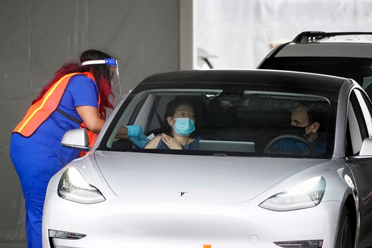 A woman gets a COVID-19 shot at the mass vaccination site located at the Delta Flight Museum, Monday, February 22, in Atlanta. 