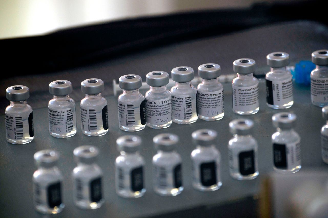 Vials of the Pfizer-BioNTech Covid-19 vaccine are prepared to be administered at a drive up vaccination in Reno, Nevada, on December 17, 2020. 