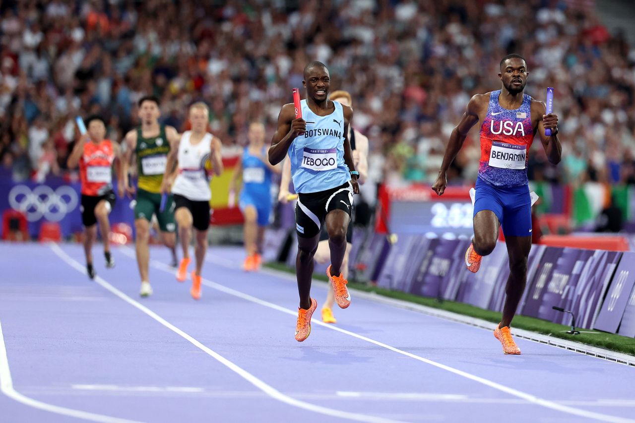 Rai Benjamin of Team USA races toward the finish line ahead Botswana's Letsile Tebogo to win the men's 4x400-meter relay Saturday. 