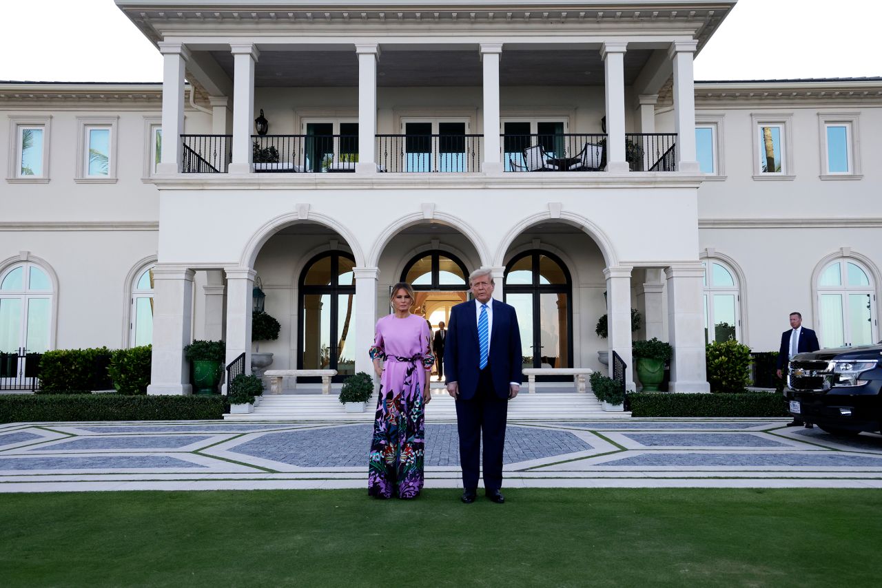 Former US President Donald Trump arrives at the home of billionaire investor John Paulson with former first lady Melania Trump on April 6, in Palm Beach, Florida. 