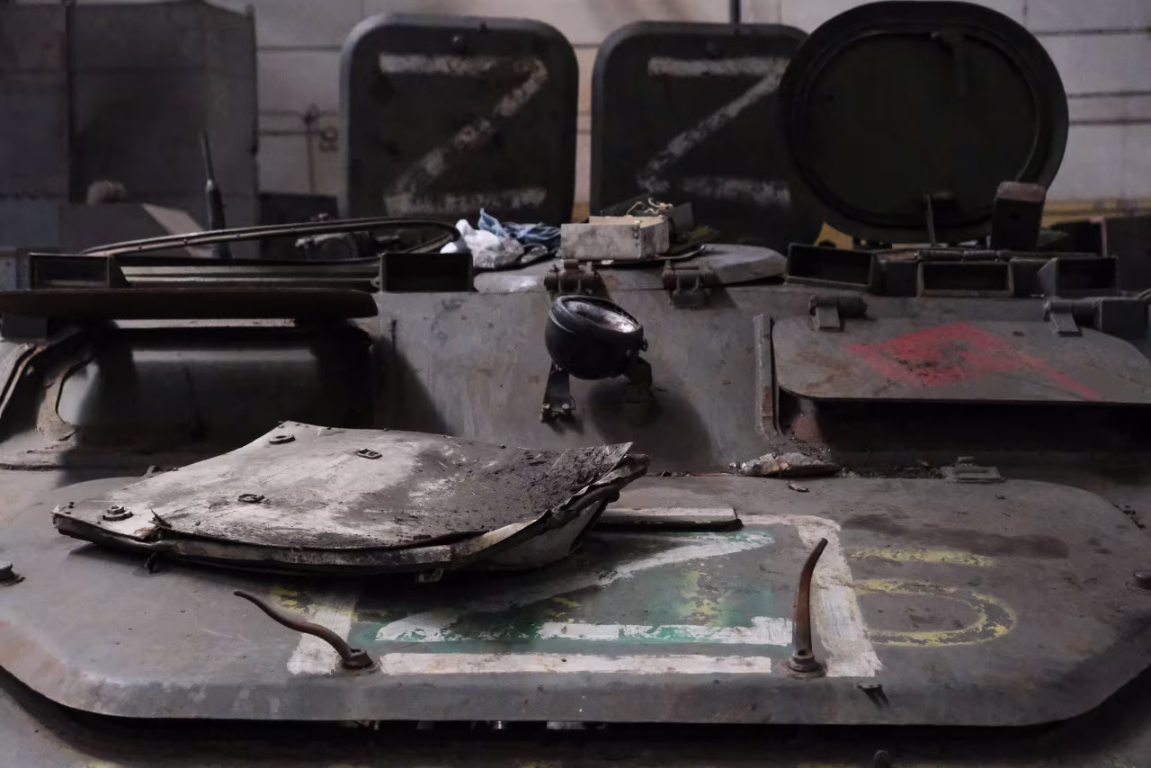 A captured Russian armored personnel carrier with the Z mark of Moscow's invasion. Ukrainian repairmen at the warehouse want to adapt this vehicle to transport wounded soldiers. 
