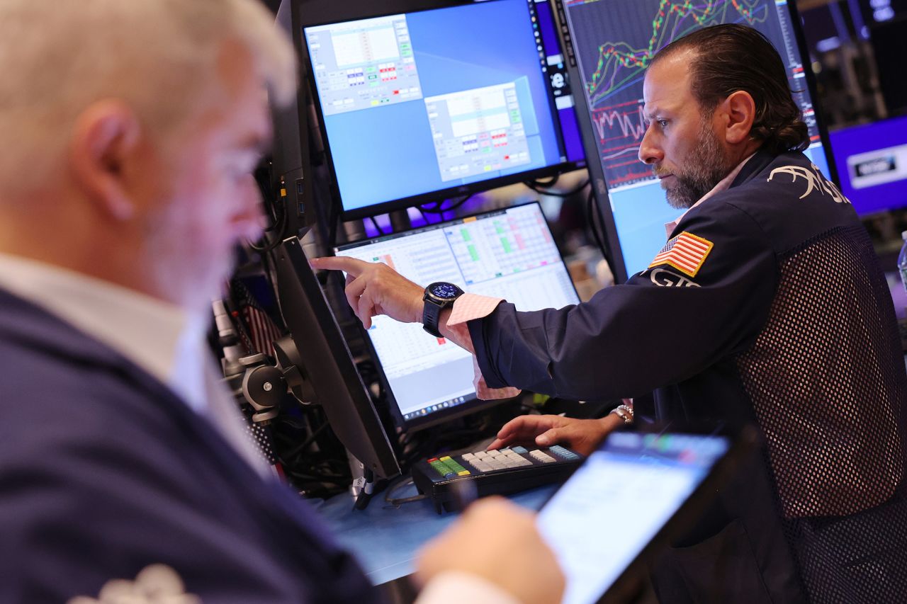 Traders work on the floor of the New York Stock Exchange during morning trading on May 31 in New York City. 