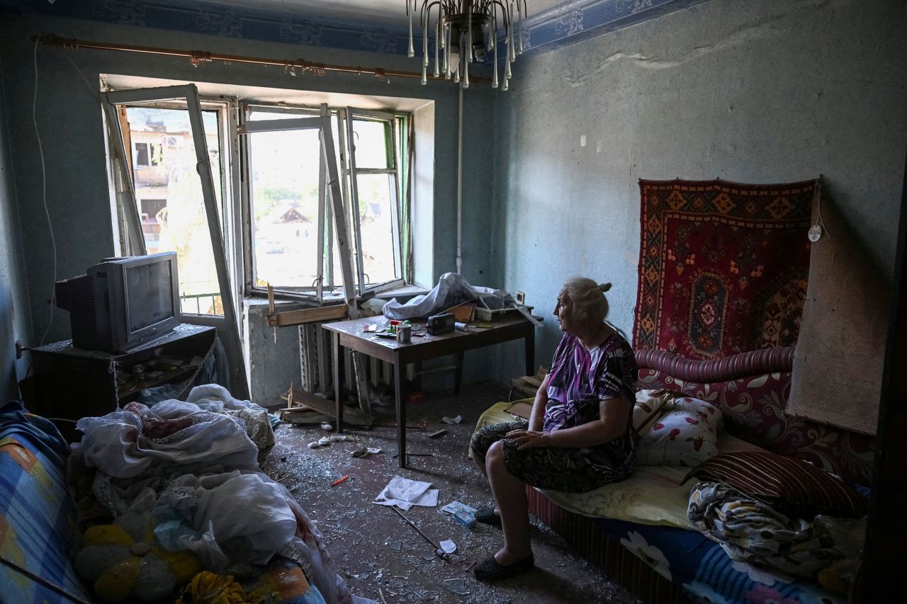 A woman sits in her destroyed apartment in a building struck by a Russian missile strike in Pokrovsk, Ukraine, on Tuesday.