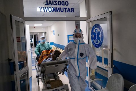Medical personnel wear personal protective equipment (PPE) as they transport a COVID -19 unvaccinated patient inside the Emergency Ward converted to a COVID -19 dirty zone at the Bochnia Hospital on December 07, 2021 in Bochnia, Poland.