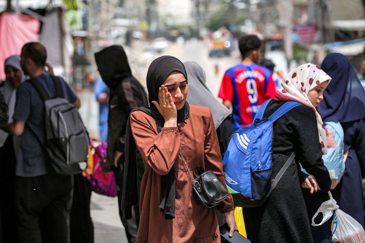 A woman prepares to evacuate Rafah, Gaza, on May 11. 