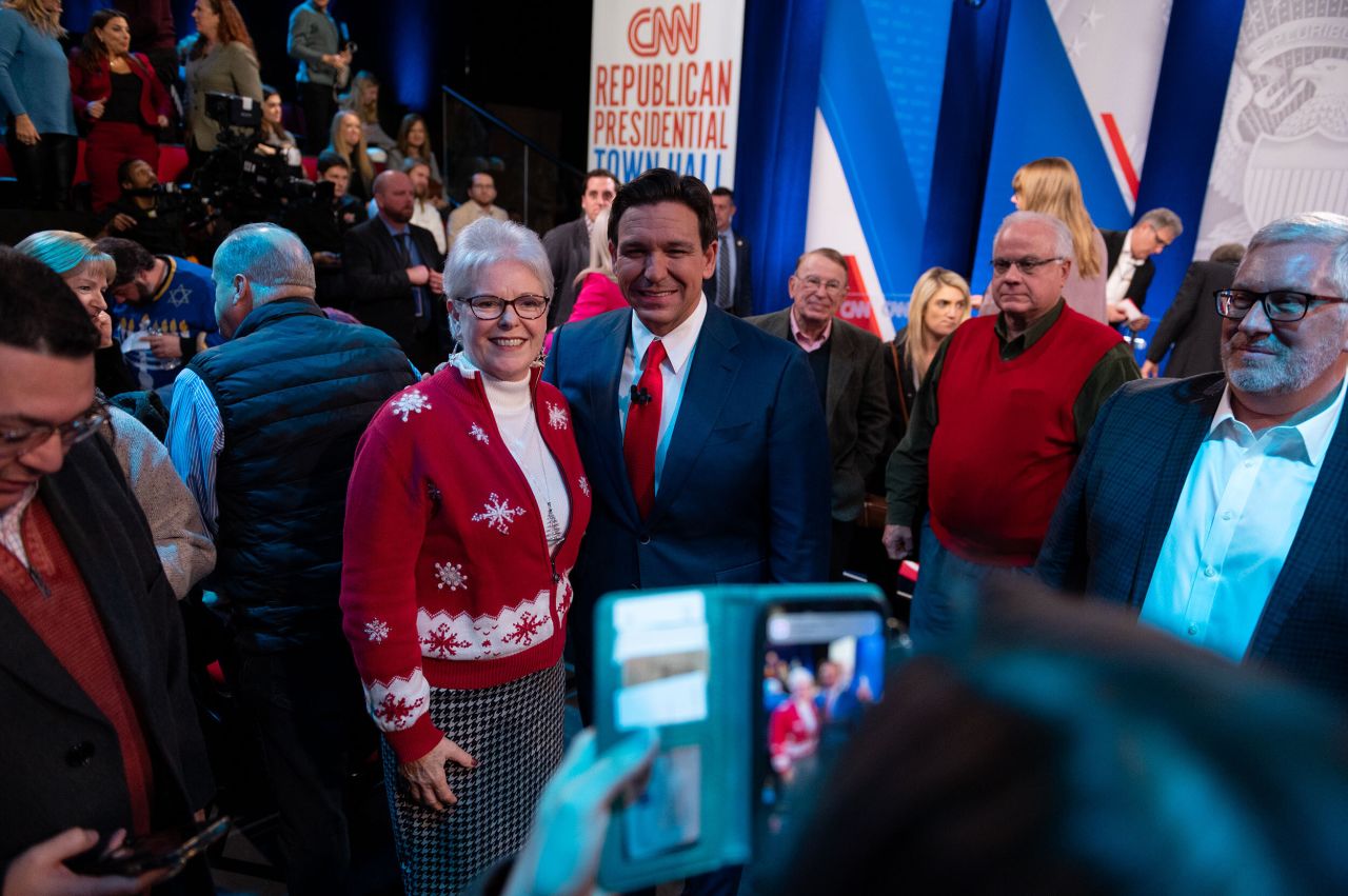 Florida Gov. Ron DeSantis poses with an audience member following the town hall.