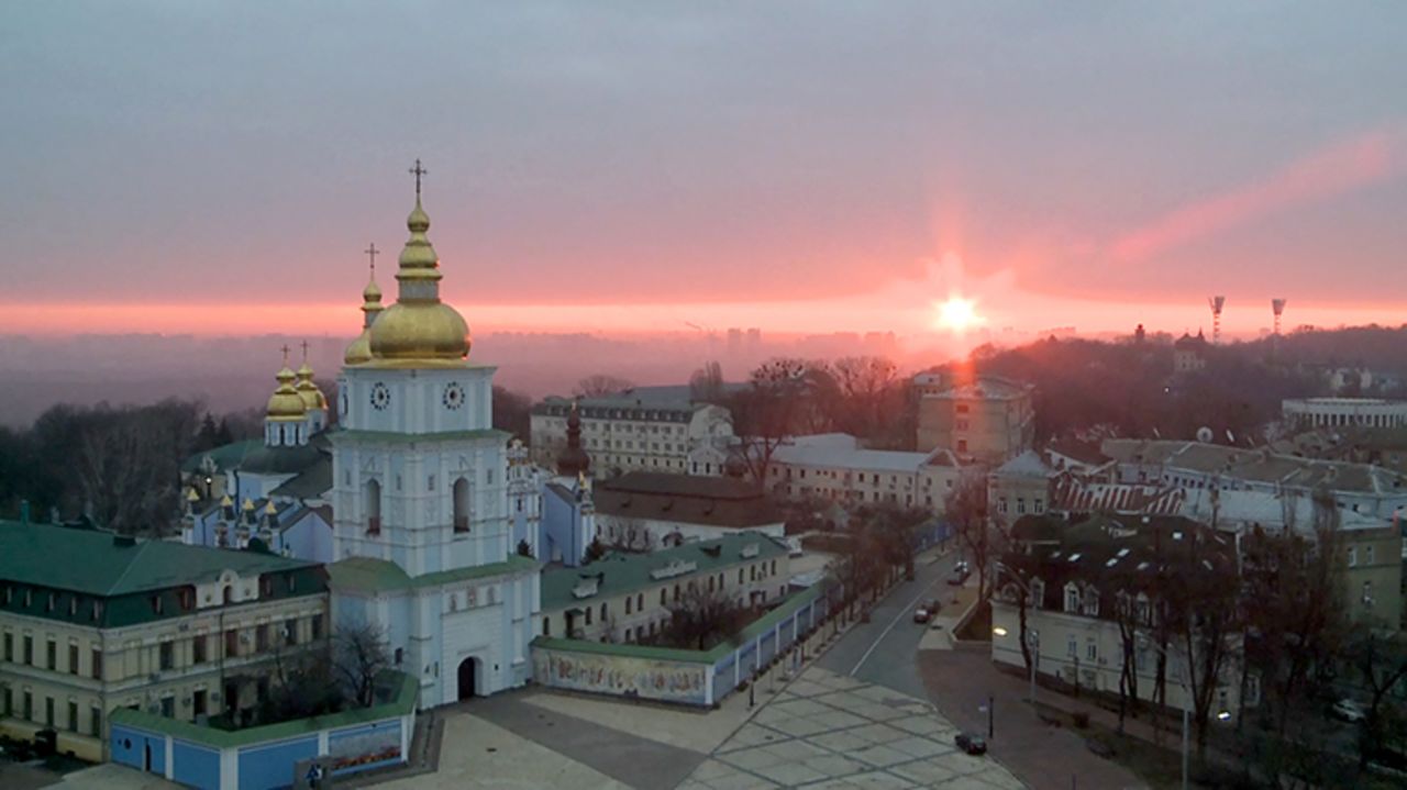 The sun rises over Ukraine's capital, Kyiv, on Friday amid Russia's invasion of its former Soviet neighbor.