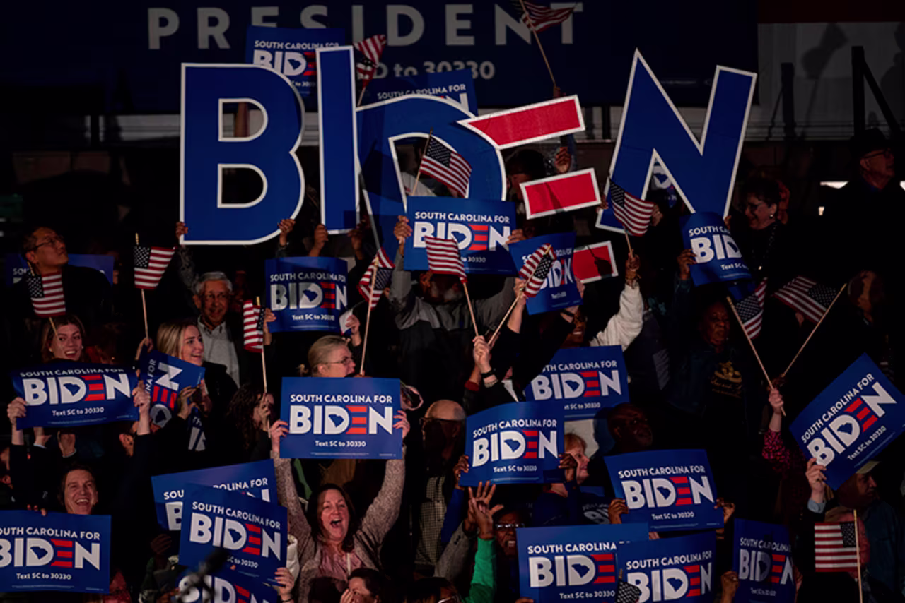 Supporters cheer as the polls close for Democratic presidential candidate Joe Biden at his primary night event in Columbia, South Carolina, on Saturday, February 29.