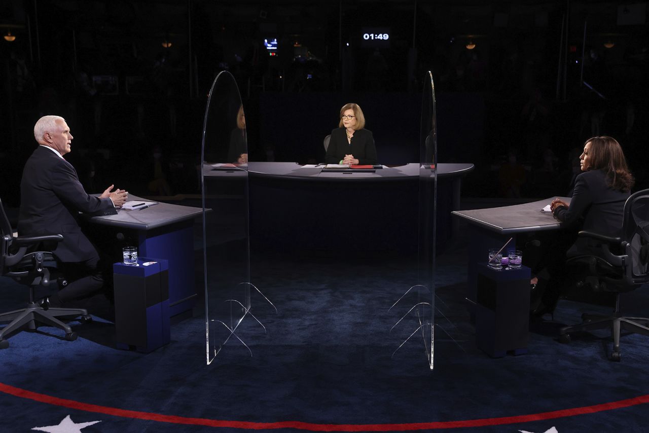 Vice President Mike Pence speaks as Democratic vice presidential candidate Sen. Kamala Harris listens during the vice presidential debate on Wednesday in Salt Lake City. 