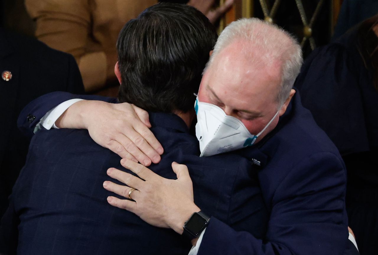 Rep. Steve Scalise embraces Representative Mike Johnson in the House Chamber at the US Capitol in Washington, DC,, on Wednesday, Oct. 25, 2023. 